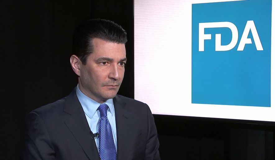 Food and Drug Administration Commissioner Scott Gottlieb listens during an interview with The Associated Press in New York on Monday, March 5, 2018. Gottlieb said Monday that he needs more staffers to intercept opioids that are being disguised as other drugs and supplements. (AP Photo/Kathy Young)