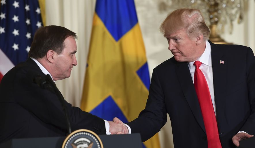 President Donald Trump, right, shakes hands with Swedish Prime Minister Stefan Lofven, left, during a news conference in the East Room of the White House in Washington, Tuesday, March 6, 2018. (AP Photo/Susan Walsh)