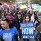 Thousands of people take part in the ``Free the People Immigration March,&#39;&#39; to protest actions taken by President Donald Trump and his administration, in Los Angeles Sunday, Feb. 18, 2017. March and rally organizers are calling for an end to ICE raids and deportations, minority killings by police and that health care be provided for documented and undocumented individuals. Immigrant, faith, labor and community groups are expected to attend, calling for sanctuary to be given to immigrants.. (AP Photo/Ringo H.W. Chiu)