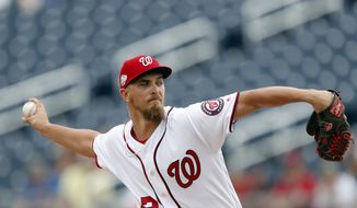 Washington Nationals starting pitcher A.J. Cole (22) works against the Houston Astros during a spring training baseball game Tuesday, March 6, 2018, in West Palm Beach, Fla. (AP Photo/John Bazemore) **FILE**