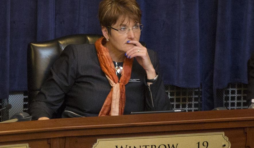 FILE - In this Jan. 8, 2018 file photo, Idaho State Rep. Melissa Wintrow, D-Boise, listens to Gov. C.L. "Butch" Otter deliver his State of the State address inside the house chambers at the state Capitol in Boise, Idaho. Idaho's House on Tuesday, March 6, rejected a proposal sponsored by Wintrow that would have prevented convicted domestic abusers from owning guns. (AP Photo/Otto Kitsinger, File)