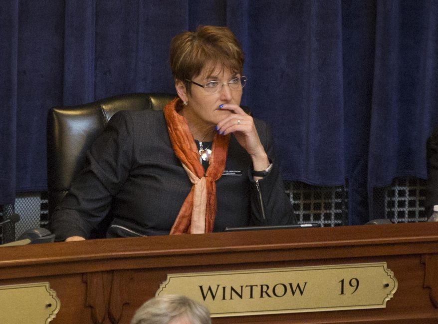 FILE - In this Jan. 8, 2018 file photo, Idaho State Rep. Melissa Wintrow, D-Boise, listens to Gov. C.L. "Butch" Otter deliver his State of the State address inside the house chambers at the state Capitol in Boise, Idaho. Idaho's House on Tuesday, March 6, rejected a proposal sponsored by Wintrow that would have prevented convicted domestic abusers from owning guns. (AP Photo/Otto Kitsinger, File)