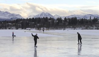 FILE - In this Jan. 2, 2018, file photo, ice skaters take advantage of unseasonable warm temperatures to ice skate outside at Westchester Lagoon in Anchorage, Alaska. New U.S. weather data shows that the Arctic just finished its warmest winter on record, with plenty of open water where the ocean normally freezes. The National Snow and Ice Data Center said Tuesday, March 6, the extent of Arctic sea ice in February was 62,000 square miles (160,000 square kilometers) smaller than last year&#39;s record low. (AP Photo/Mark Thiessen, File)
