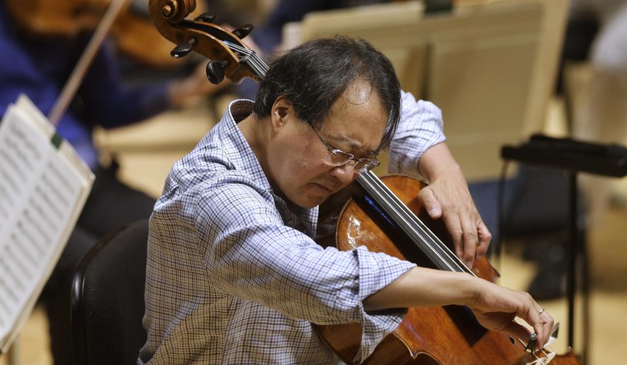 FILE - In this Nov. 20, 2014 file photo, cellist Yo-Yo Ma rehearses Prokofiev's Symphony Concerto for cello and orchestra at Symphony Hall in Boston. The World-famous cellist performed a special concert for the California children who authorities said were starved and shackled to their beds by their parents. Corona Mayor Karen Spiegel says Ma performed Friday, March 2, 2018 at the Corona Regional Medical Center. (AP Photo/Steven Senne, File)
