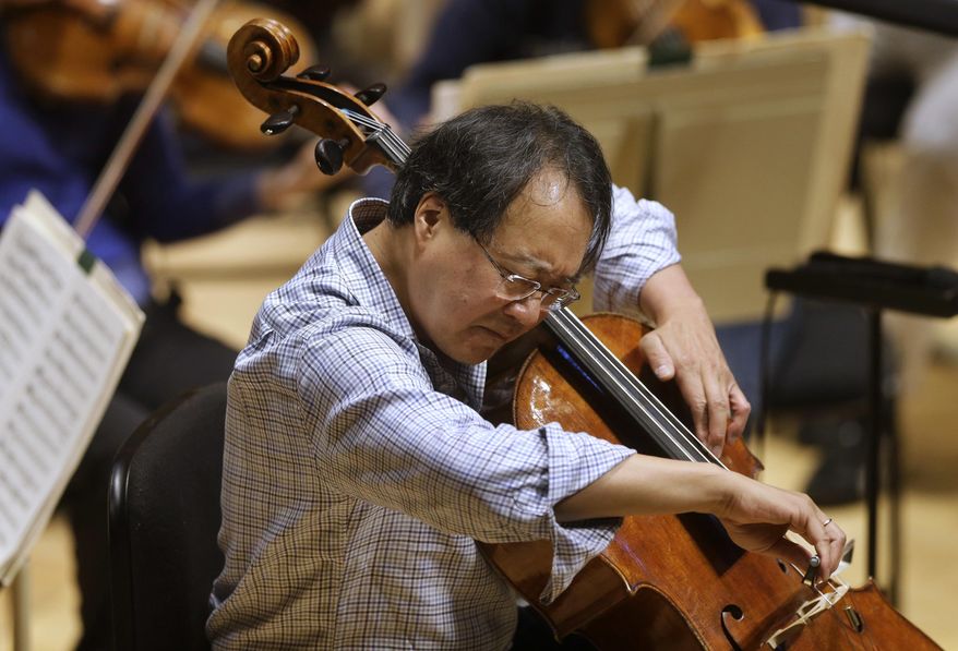 FILE - In this Nov. 20, 2014 file photo, cellist Yo-Yo Ma rehearses Prokofiev's Symphony Concerto for cello and orchestra at Symphony Hall in Boston. The World-famous cellist performed a special concert for the California children who authorities said were starved and shackled to their beds by their parents. Corona Mayor Karen Spiegel says Ma performed Friday, March 2, 2018 at the Corona Regional Medical Center. (AP Photo/Steven Senne, File)