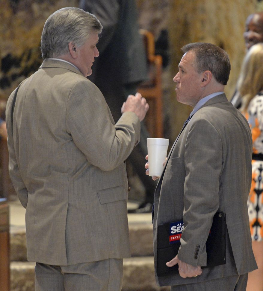 Rep. Lance Harris, R-Alexandria, left, and Rep. Alan Seabaugh, R-Shreveport, right, chat before the House convenes in a special session to address the state's fiscal crisis Monday, March 5, 2018, in Baton Rouge, La. (Bill Feig/The Advocate via AP)