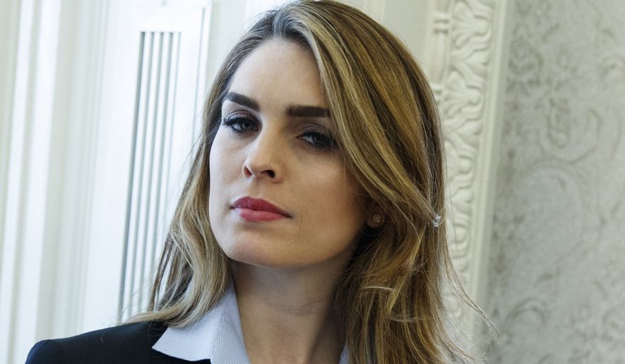 In this Feb. 9, 2018 photo, White House Communications Director Hope Hicks is shown during a meeting in the Oval Office between President Donald Trump and Shane Bouvet, in Washington.  Hicks, one of President Donald Trump&#39;s most loyal aides, is resigning. In a statement, the president praises Hicks for her work over the last three years. He says he &quot;will miss having her by my side.&quot; The news comes a day after Hicks was interviewed for nine hours by the panel investigating Russia interference in the 2016 election and contact between Trump&#39;s campaign and Russia.  (AP Photo/Evan Vucci)