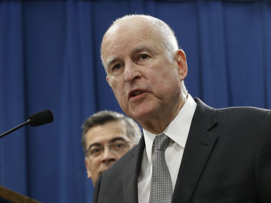 California Gov. Jerry Brown, right, accompanied by California Attorney General Xavier Becerra, responds to remarks made U.S. Attorney General Jeff Sessions, Wednesday, March 7, 2018, in Sacramento, Calif. (AP Photo/Rich Pedroncelli)