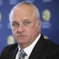 Graham Arnold attends a press conference where he will sign a four-year contract to coach the Australian national soccer team in Sydney, Thursday, March 8, 2018. Arnold, current coach of A-League champions Sydney FC, will replace Dutchman Bert van Marwijk after the World Cup in Russia. (AP Photo/Rick Rycroft)