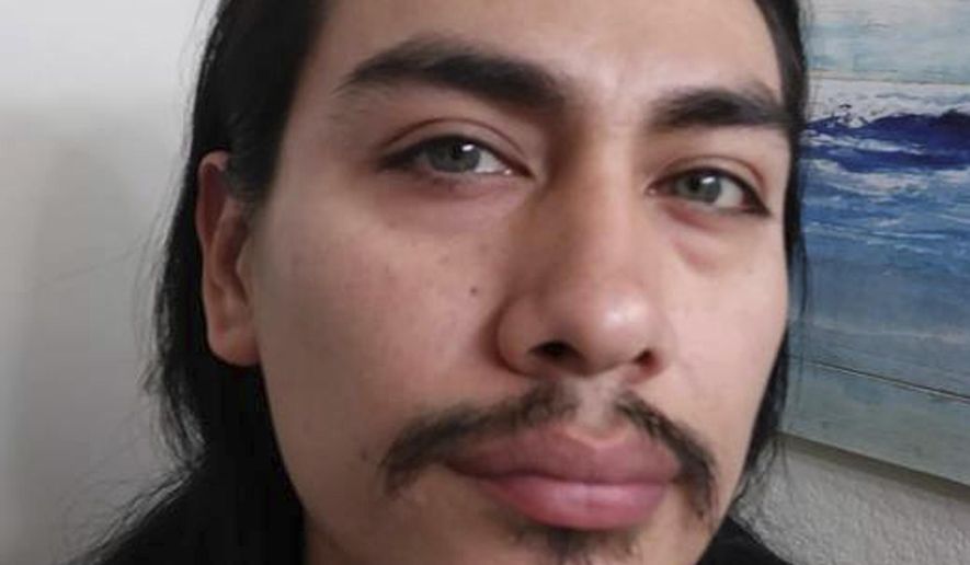 This undated photo provided by the Island County Sheriff's office shows Jacob Gonzales. Washington State police say the body of a woman found near a gun and ammo-filled bunker had been decapitated, and a man wanted in the case, Gonzales, is on the loose and possibly headed for southern or central California. (Island County Sheriff's Office via AP)
