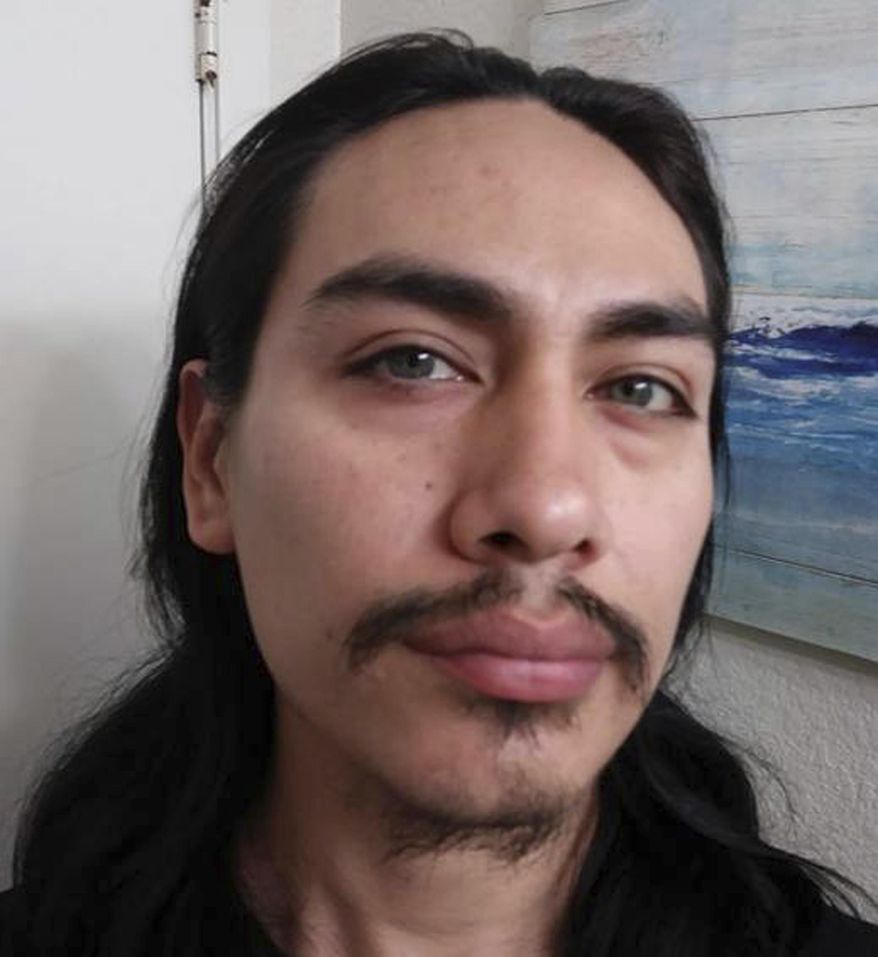 This undated photo provided by the Island County Sheriff's office shows Jacob Gonzales. Washington State police say the body of a woman found near a gun and ammo-filled bunker had been decapitated, and a man wanted in the case, Gonzales, is on the loose and possibly headed for southern or central California. (Island County Sheriff's Office via AP)