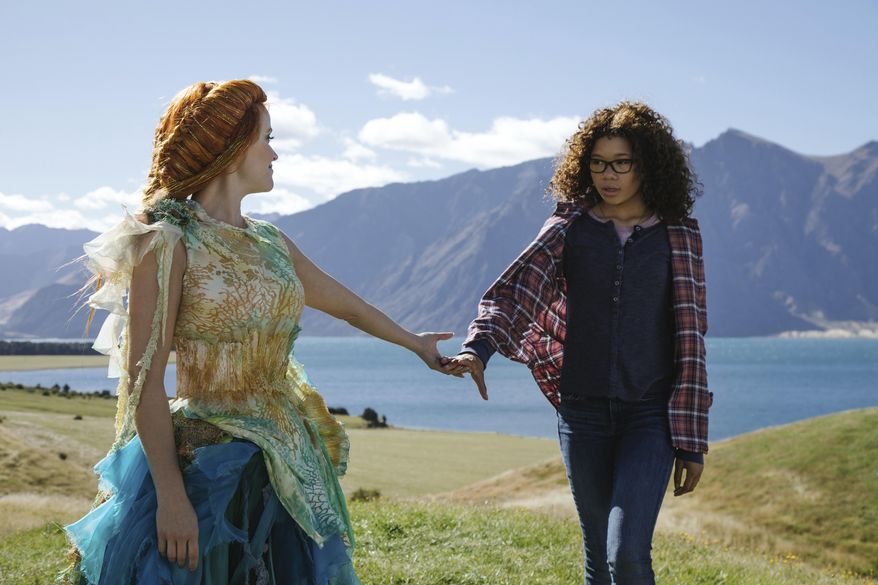 This image released by Disney shows Reese Witherspoon, left, and Storm Reid in a scene from "A Wrinkle In Time." (Atsushi Nishijima/Disney via AP)