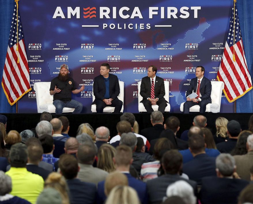 The crowd listened to a panel discussion with, from th eleft; Daniel Harrison with Country Boy Brewing, Bill Quigg with More Than A Bakery, Congressman Andy Barr, Ian Boccaccio with Ryan, during the fifth in a series of tax policy events hosted by America First Policies held Wednesday, March 7, 2018, at More Than A Bakery in Versailles, Ky. The series, "Tax Cuts to Put America First," featured guest speakers including Vice President Mike Pence. (Charles Bertram/Lexington Herald-Leader via AP)