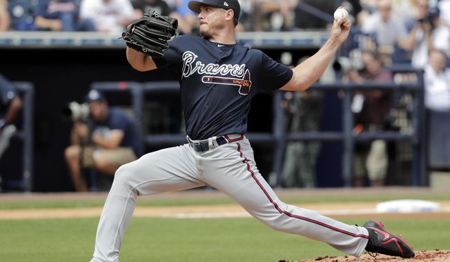 FILE - In this March 2, 2018, file photo, Atlanta Braves starting pitcher Scott Kazmir delivers during the first inning of a baseball spring exhibition game against the New York Yankees, in Tampa, Fla. Kazmir is trying to revive his career after missing all of last season, and he might've come to the right place. (AP Photo/Lynne Sladky, File)