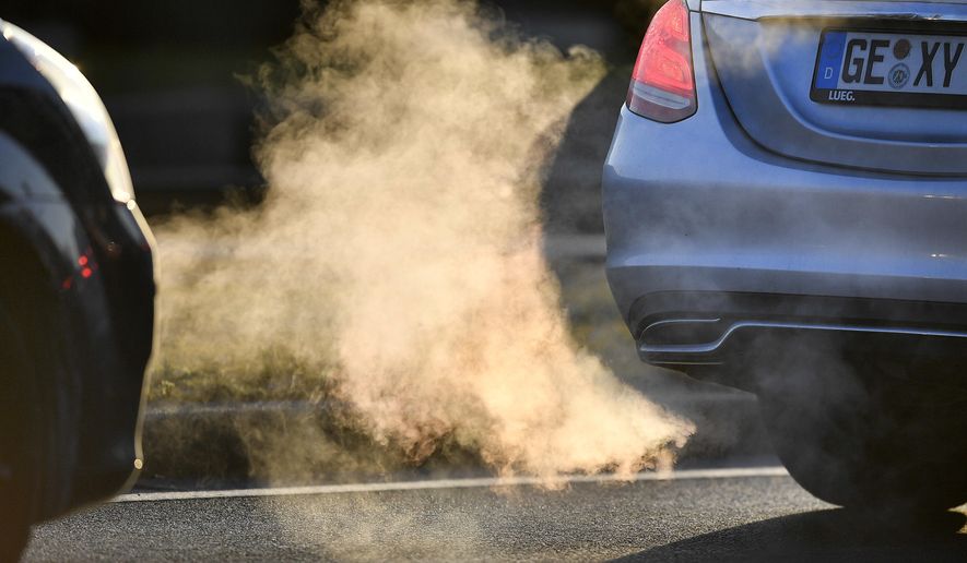 FILE - In this Feb. 27, 2018 file photo commuters drive in their cars to work in Gelsenkirchen, Germany. Thousands of people die prematurely each year in Germany from the harmful effects of nitrogen dioxide, a gas that’s produced by diesel engines, according to a government-sponsored report published Thursday March 8, 2018. (AP Photo/Martin Meissner,file)
