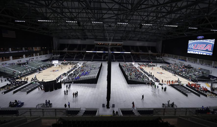 A general, overall view of Ford Center as Florida International University plays Southern Miss on Court A, at left, and University of Texas San Antonio plays University of Texas El Paso on Court B, at right, simultaneously on the first day of the men's and women's Conference USA basketball tournament in Frisco, Texas, Wednesday, March 7, 2018. (AP Photo/Tony Gutierrez)