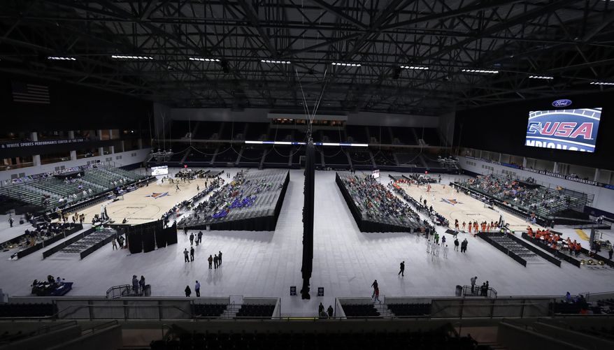 A general, overall view of Ford Center as Florida International University plays Southern Miss on Court A, at left, and University of Texas San Antonio plays University of Texas El Paso on Court B, at right, simultaneously on the first day of the men's and women's Conference USA basketball tournament in Frisco, Texas, Wednesday, March 7, 2018. (AP Photo/Tony Gutierrez)
