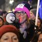 Protesters take part in a Women&#39;s Day march in Warsaw, Poland, Thursday, March 8, 2018. A few thousand women and men chanting women&#39;s rights slogans marched through  central Warsaw to mark the International Women&#39;s Day. (AP Photo/Alik Keplicz)