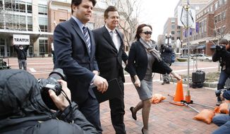Paul Manafort, center, President Donald Trump&#x27;s former campaign chairman, walks with this wife Kathleen Manafort, as they arrive at the Alexandria Federal Courthouse for an arraignment hearing on his Eastern District of Virginia charges, in Alexandria, Va., Thursday, March 8, 2018.  Jason Maloni, Manafort&#x27;s spokesman, is at left.  (AP Photo/Jacquelyn Martin)