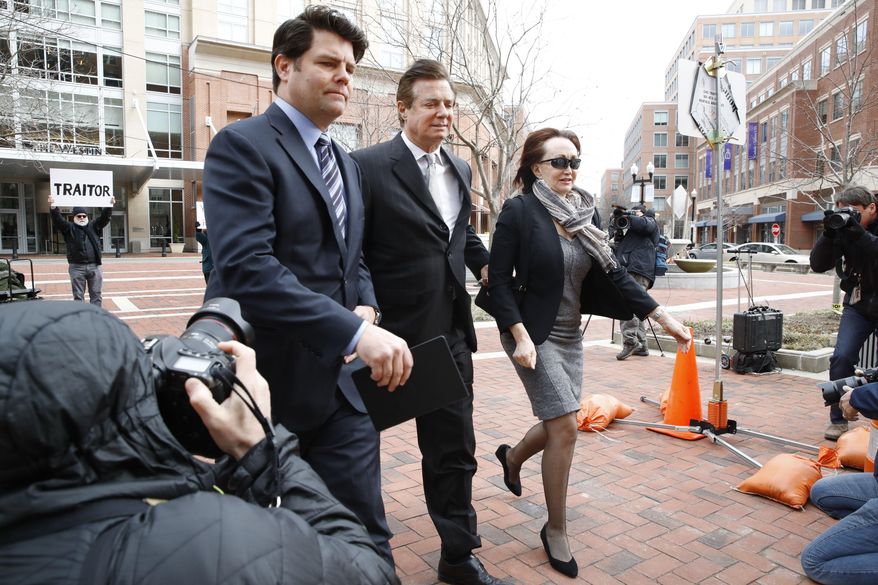 Paul Manafort, center, President Donald Trump&#39;s former campaign chairman, walks with this wife Kathleen Manafort, as they arrive at the Alexandria Federal Courthouse for an arraignment hearing on his Eastern District of Virginia charges, in Alexandria, Va., Thursday, March 8, 2018.  Jason Maloni, Manafort&#39;s spokesman, is at left.  (AP Photo/Jacquelyn Martin)