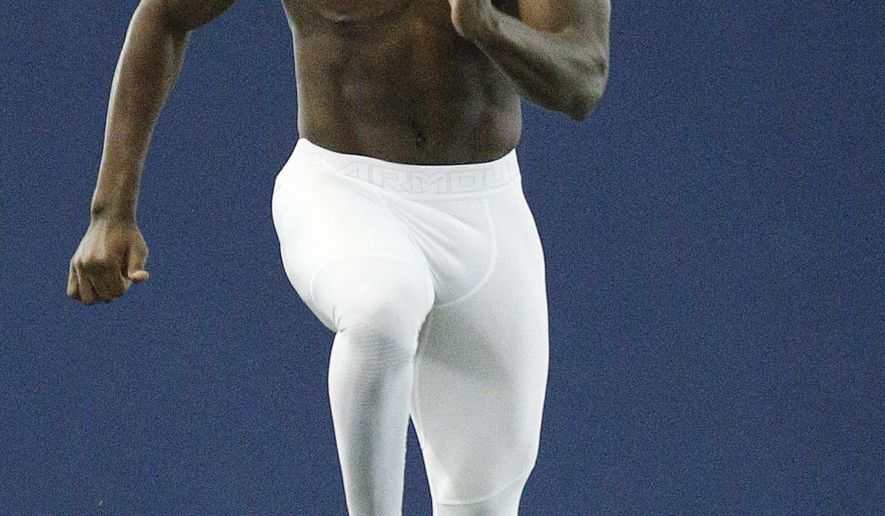 Auburn running back Kerryon Johnson runs the 40-yard dash during Auburn's Pro Day, Friday, March 9, 2018, in Auburn, Ala. The event is to showcase players for the upcoming NFL football draft. (AP Photo/Brynn Anderson)