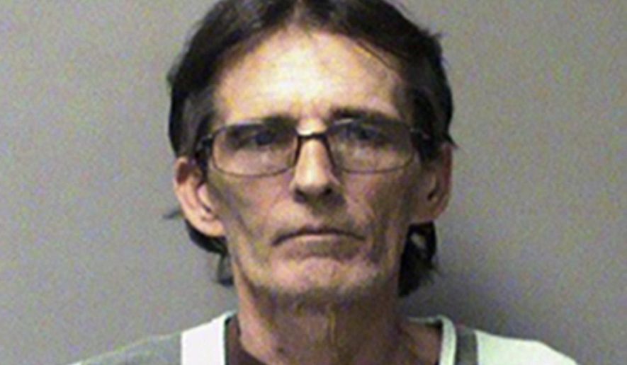 FILE - This March 8, 2016 booking photo released by the Polk County Jail in Des Moines, Iowa shows John Wayne Alexander. Alexander, a former Iowa Department of Transportation examiner, is charged with forcing a woman to view sexually explicit photos and videos of himself during a test drive. The woman is suing the Iowa Department of Transportation for monetary damages. Alexander, was fired and pleaded guilty to felony misconduct. He received two years of probation. (Polk County Jail via AP File)