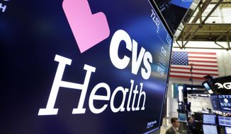 FILE- In this Dec. 4, 2017, file photo, the CVS Health logo appears above a trading post on the floor of the New York Stock Exchange. Insurers are dropping billions of dollars on acquisitions and expansions as they get more involved in their customers’ health. Late last year, CVS Health announced a roughly $69 billion deal to buy another insurer, Aetna. Those companies plan to convert drugstores into health care hotspots that people can turn to for a variety of needs in between doctor visits. (AP Photo/Richard Drew, File)