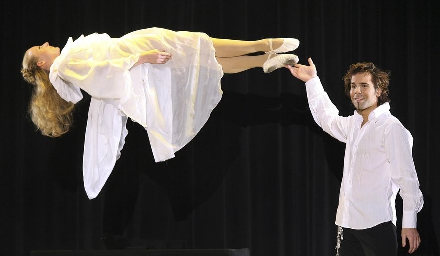 FILE - This March 17, 2007, file photo, magician Jan Rouven presents the Floating Virgin during the dress rehearsal of a German TV show in Riesa, eastern Germany. A federal judge is hearing testimony from former lawyers for the ex-Las Vegas Strip illusionist, from Germany who is trying to withdraw his guilty plea in a pornography case that could get him at least 24 years in prison. (AP Photo/Eckehard Schulz, File)