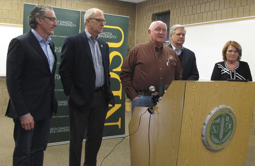 U.S. Agriculture Secretary Sonny Perdue talks at a news conference in Fargo, N.D., on Friday, March 9, 2018. Perdue spoke about how President Donald Trump's tariffs on steel and aluminum might help farmers get a better deal in the long run if the North American Free Trade Agreement is improved. From left are North Dakota Gov. Doug Burgum, U.S Rep. Kevin Cramer, Perdue, and U.S. Sens. John Hoeven and Heidi Heitkamp. It was the first trip to North Dakota for Perdue, who has now visited 34 states. (AP Photo/Dave Kolpack)