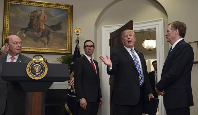 President Donald Trump, second from right, makes a comment as he leaves the Roosevelt Room at the White House in Washington, Thursday, March 8, 2018, following an event where he signed two proclamations, one on steel imports and the other on aluminum imports. Watching as Trump leaves are, from left, Commerce Secretary Wilbur Ross, Treasury Secretary Steven Mnuchin, and U.S. Trade Representative Robert Lighthizer. (AP Photo/Susan Walsh)