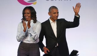 Former President Barack Obama and former first lady Michelle Obama have signed a multiyear deal with Netflix. (Associated Press/File)