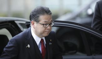 Japanese Minister for Economy, Trade and Industry Hiroshige Seko arrives for a meeting at EU headquarters in Brussels on Saturday, March 10, 2018. The EU will meet with Japanese and US officials on Saturday to seek more clarity on US tariffs on steel and aluminum. (AP Photo/Olivier Matthys)