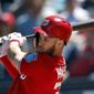 Washington Nationals right fielder Bryce Harper (34) drives in a run with a base hit in the fifth inning of a spring training baseball game against the New York Mets, Thursday, March 8, 2018, in West Palm Beach, Fla. (AP Photo/John Bazemore)