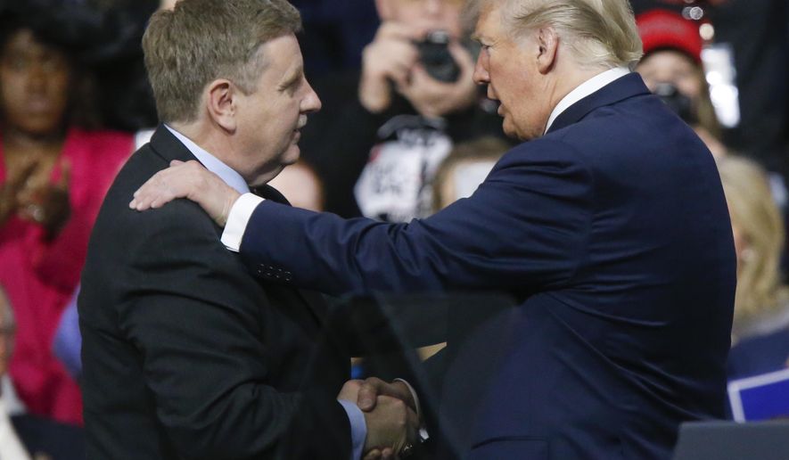 President Donald Trump, right, talks with Republican Rick Saccone during a campaign rally, Saturday, March 10, 2018, in Moon Township, Pa. Saccone is running against Democrat Conor Lamb in a special election being held on March 13 for the Pennsylvania 18th Congressional District vacated by Republican Tim Murphy. (AP Photo/Keith Srakocic)