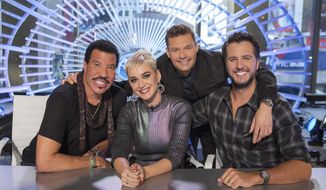 This image released by ABC shows, from left, Lionel Richie, Katy Perry, Ryan Seacrest and Luke Bryan in New York. Richie, Perry and Bryan are the judges on the next season of &amp;quot;American Idol,&amp;quot; premiering March 11 on ABC. (Eric Liebowitz/ABC via AP)