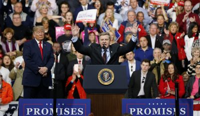 Republican Rick Saccone greeted the crowd during a campaign rally with President Donald Trump on Saturday in Moon Township, Pennsylvania. His Democratic opponent is keeping his distance from the president. (Associated Press)