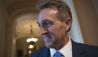 Sen. Jeff Flake, R-Ariz., who announced last year he would not run for re-election in 2018, takes questions from reporters at the Capitol in Washington, Thursday, Jan. 4, 2018.  (AP Photo/J. Scott Applewhite)