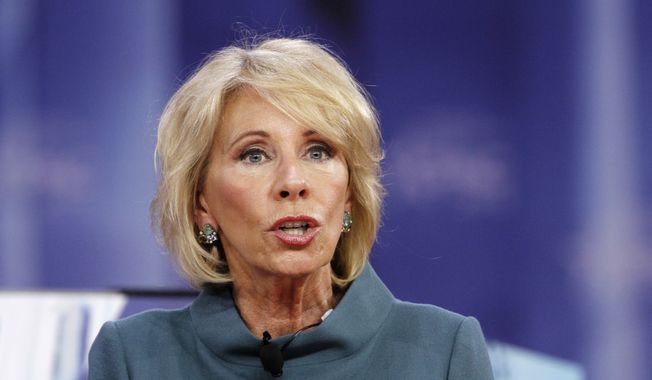 In this Feb. 22, 2018, file photo, Education Secretary Betsy DeVos speaks during the Conservative Political Action Conference (CPAC), at National Harbor, Md. (AP Photo/Jacquelyn Martin, File)