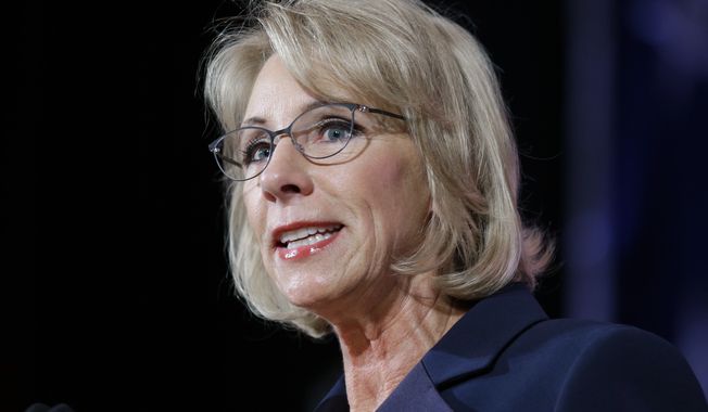 U.S. Education Secretary Betsy DeVos speaks during a dinner hosted by the Washington Policy Center, Friday, Oct. 13, 2017, in Bellevue, Wash. (AP Photo/Ted S. Warren)