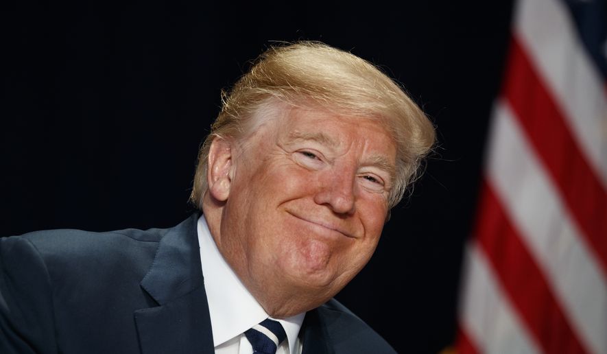 President Donald Trump smiles during the National Prayer Breakfast, Thursday, Feb. 8, 2018, in Washington. (AP Photo/Evan Vucci)