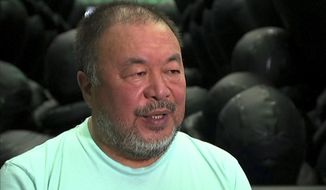 In this image made from a video, Chinese dissident artist Ai Weiwei speaks during his exhibition in Sydney, Monday, March 12, 2018.  Ai said Monday that it doesn&#39;t matter whether or not China has a change in leadership, the culture and the system will always remain the same. He launched an exhibition in Sydney to highlight the international refugee crisis. (Australia Broadcasting Corporation via AP)