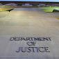 In this May 14, 2013, file photo, the Department of Justice headquarters building in Washington is photographed early in the morning. (AP Photo/J. David Ake, File) **FILE**