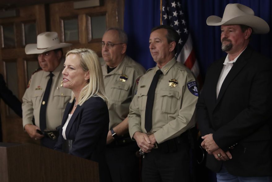 Secretary of Homeland Security Kirstjen Nielsen stands with a group of Texas sheriffs during a news conference to address sanctuary cities, Tuesday, Dec. 12, 2017, in Austin, Texas. (AP Photo/Eric Gay)