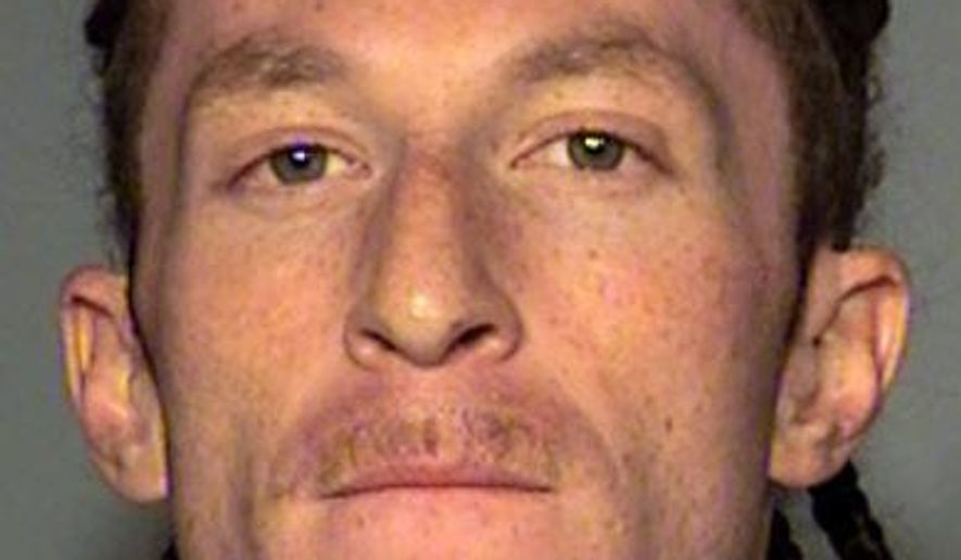 This undated booking photo provided by Las Vegas Metropolitan Police Department in March 2018 shows Cameron James Kennedy of Las Vegas. Kennedy is accused of accused of covering his face with black makeup during the armed robbery of a Las Vegas Strip casino cashier on Jan. 10, 2018. Kennedy made an initial court appearance Monday, March 12, 2018, in U.S. District Court in Las Vegas following his Jan. 25, 2018, arrest on a federal robbery charge. (Clark County Detention Center via AP)