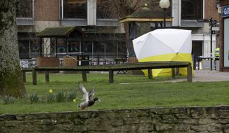 A police tent covers the area where former Russian double agent Sergei Skripal and his daughter were found critically ill following exposure to the Russian-developed nerve agent Novichok in Salisbury, England, Tuesday, March 13, 2018.  (AP Photo/Matt Dunham)