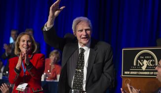 FILE – In this April 22, 2014, file photo, former New Jersey Gov. Brendan Byrne waves as the audience sings him &amp;quot;Happy Birthday&amp;quot; and his wife Ruthi Zinn Byrne applauds, to mark his 90th birthday during the annual &amp;quot;Congressional Dinner&amp;quot; of the New Jersey State Chamber of Commerce in Washington, D.C. A ceremony at Healy’s Tavern in Jersey City on Friday, March 16, 2018, will honor Byrne, who died in January at age 93. Byrne used to joke he wanted his ashes placed in Hudson County, known for its history of political shenanigans, so he could stay active in politics. (AP Photo/Cliff Owen, File)