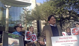 FILE - In this Feb. 8, 2018, file photo, Scott Eustis, a community science director for the Gulf Restoration Network, speaks before a hearing in federal court in New Orleans. A company building a crude oil pipeline in Louisiana asked a federal appeals court Tuesday, March 13, 2018, for an order that would allow it to immediately resume construction work in an environmentally fragile swamp. A three-judge panel from the 5th U.S. Circuit Court of Appeals didn’t immediately rule after hearing arguments from attorneys for Bayou Bridge Pipeline LLC and environmental groups opposed to the project. (AP Photo/Michael Kunzelman, File)