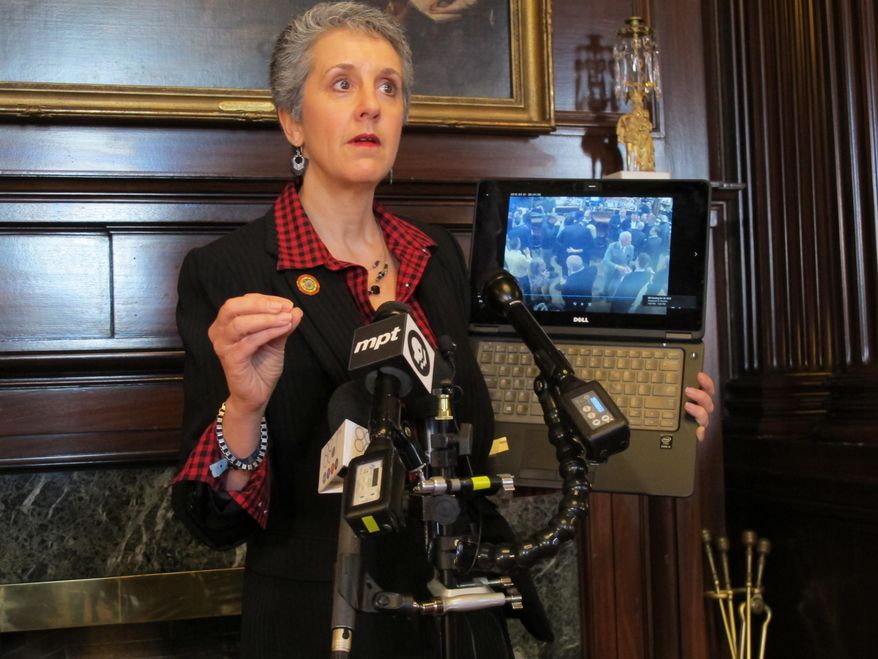 Maryland state Sen. Cheryl Kagan shows security video during a news conference on Tuesday, March 13, 2018 at the Maryland State House in Annapolis, Maryland. She says the video supports her allegations that a lobbyist touched her inappropriately after putting his hand on her back at a tavern earlier this month. The lobbyist is adamantly denying the allegations, saying the video shows he did not touch her inappropriately. (AP Photo/Brian Witte)