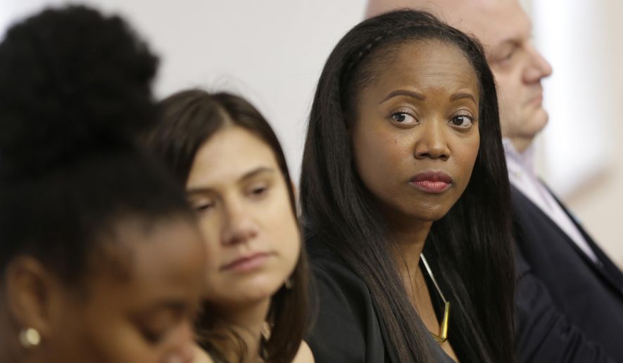 In this Feb. 20, 2018, photo, Erika Alexander attends a discussion about subminimum wage workers that depend on tips for their living in New York. Alexander was there to support the idea of one fair wage for all workers. (AP Photo/Seth Wenig)