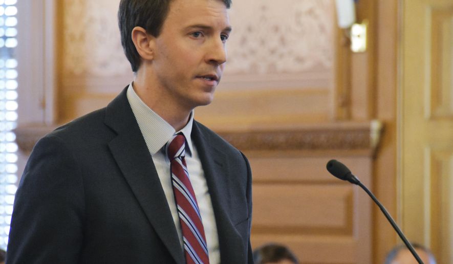 Bryan Seeley, a Major League Baseball senior vice president, testifies on a bill that would legalize sports betting in Kansas during a legislative committee hearing, Tuesday, March 13, 2018, at the Statehouse in Topeka, Kan. The league says it is neutral on bill, opposing sports betting but wanting a piece of the revenues if Kansas legalizes it. (AP Photo/Mitchell Willetts)